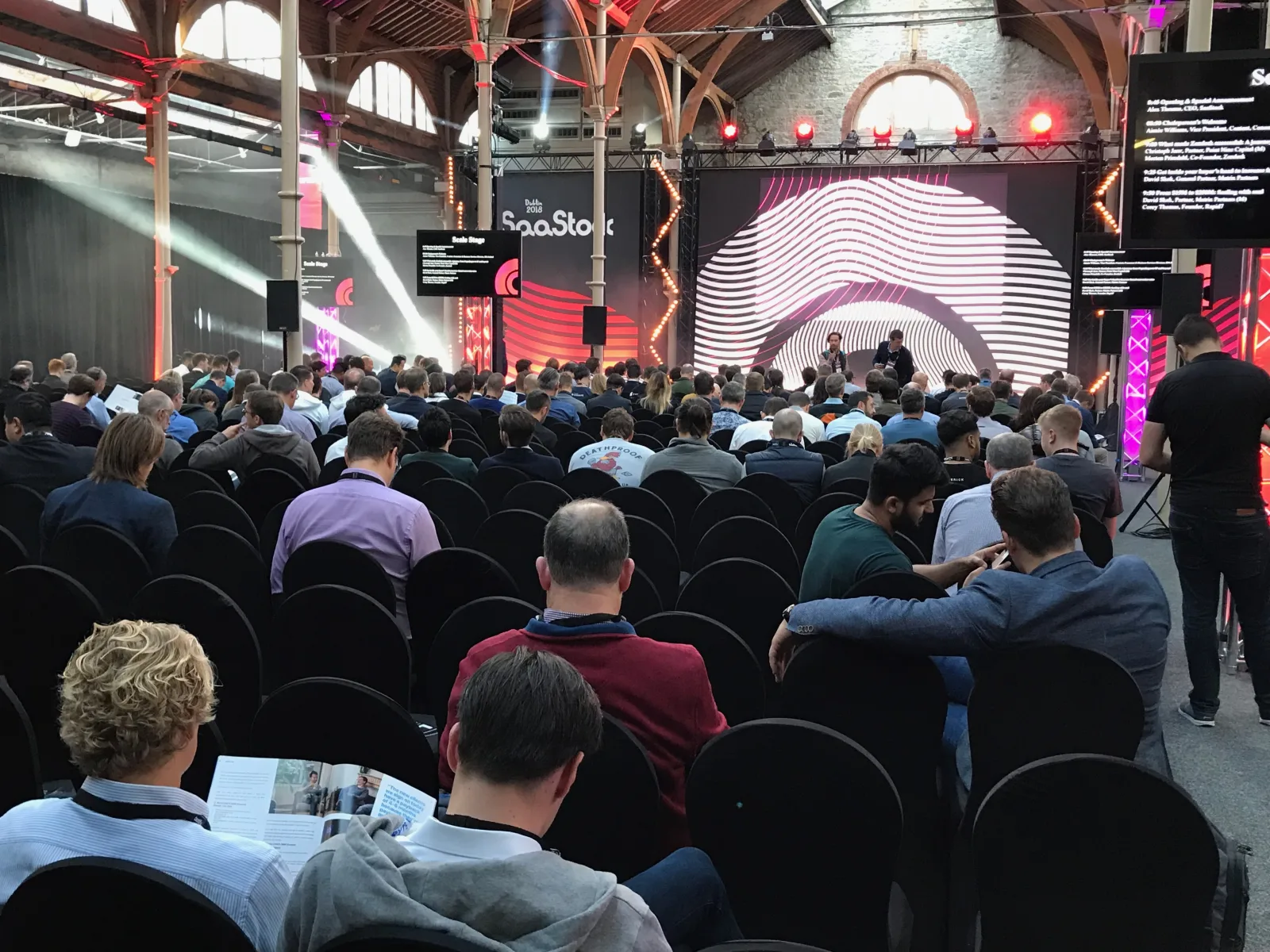 Live at SaaStock Europe 2018 — Scale Stage in the RDS Industries Hall with a packed audience under the iconic brick-and-iron timber roof