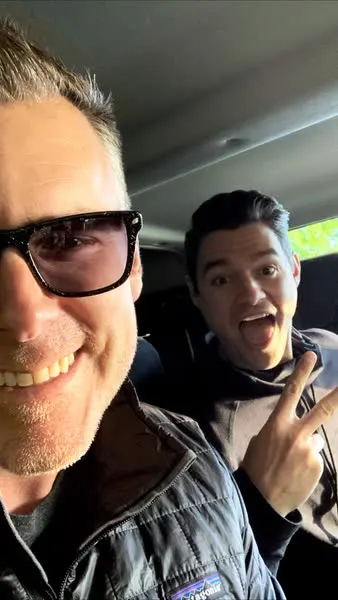 Two founders selfie inside an SUV en route to the SaaSociety Founder Retreat Land Rover Defender off-road convoy at Powerscourt Estate