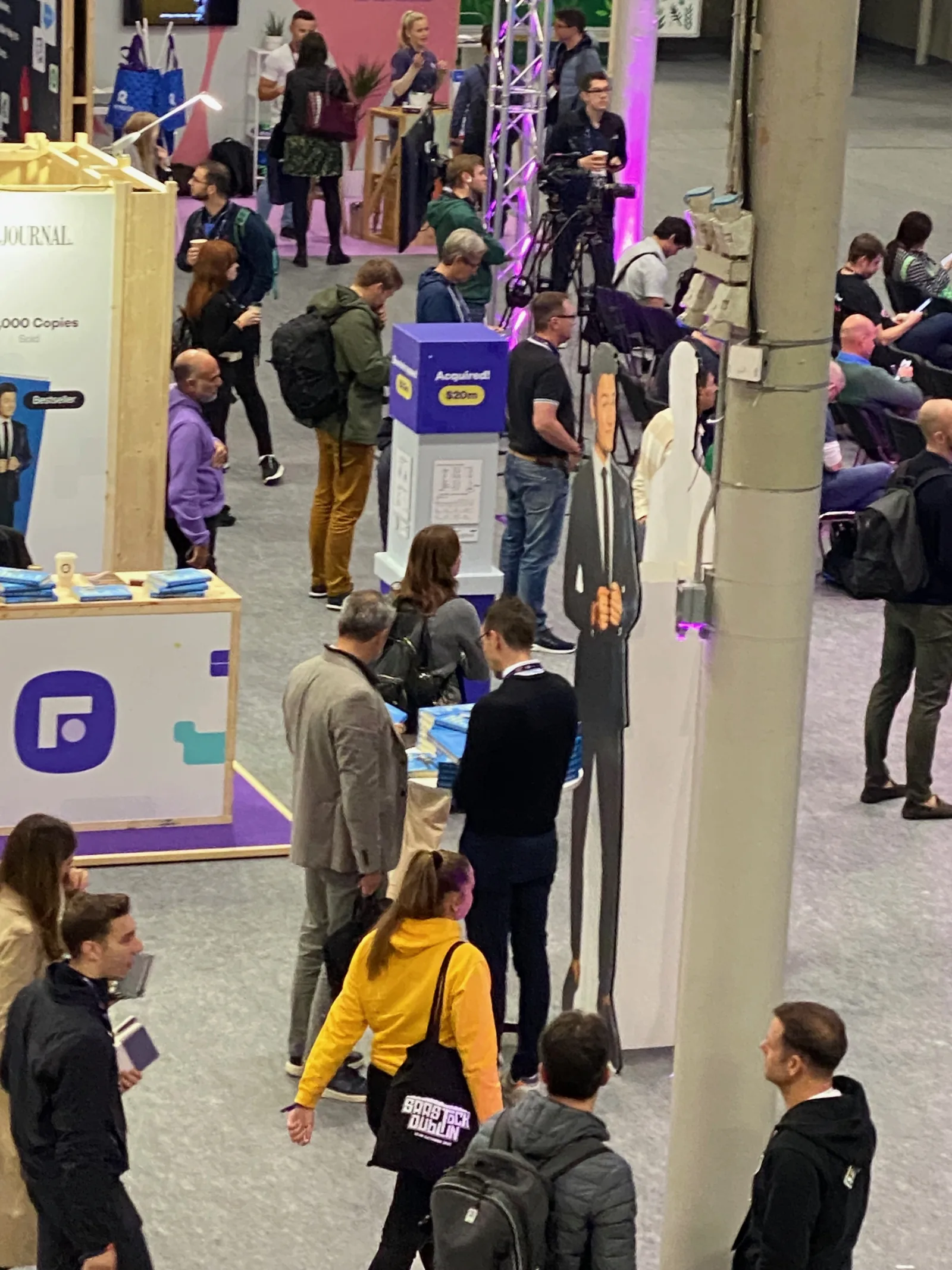 Live at SaaStock Europe 2023 — mid-day foot traffic at peak with attendees three-deep around the Founderpath booth