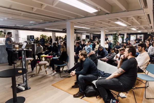 Live at SaaStock Local London — wide rear view of the full UK SaaS audience seated for the founder talk